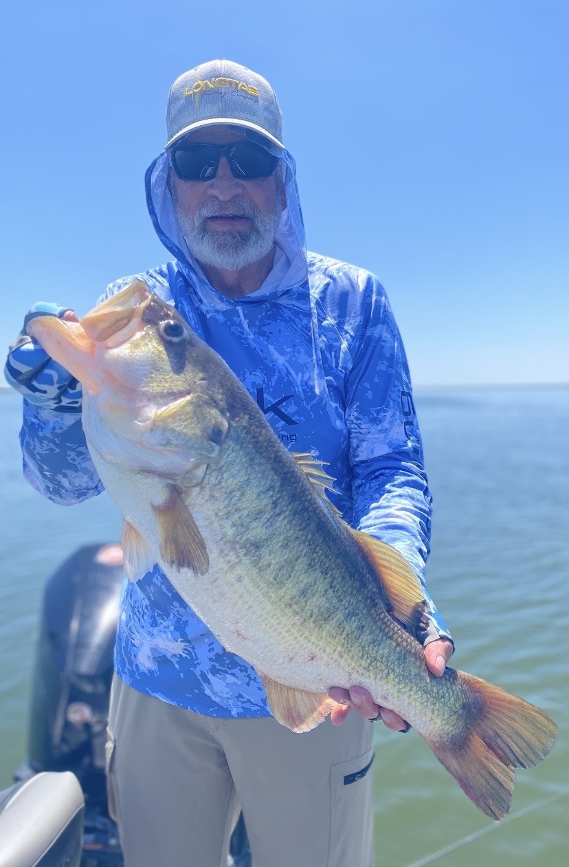 Angler holding massive largemouth bass